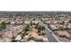 An aerial view shows a well-planned residential neighborhood with mature trees lining the streets at 6209 Lenaking Ave, Las Vegas, NV 89122