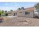 The backyard showcases a patio, desert landscaping, and the home's exterior, perfect for outdoor relaxation at 6209 Lenaking Ave, Las Vegas, NV 89122