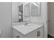 Bathroom featuring a white sink, light counter and updated fixtures at 6209 Lenaking Ave, Las Vegas, NV 89122
