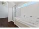 Bathroom featuring a glass shower and separate jetted tub at 6209 Lenaking Ave, Las Vegas, NV 89122