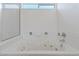 Close-up of jetted bathtub featuring glass shower at 6209 Lenaking Ave, Las Vegas, NV 89122