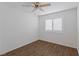 Neutral bedroom featuring a window with plantation shutters and ceiling fan at 6209 Lenaking Ave, Las Vegas, NV 89122