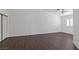 Empty bedroom with wood floors, a ceiling fan, and bright natural light at 6209 Lenaking Ave, Las Vegas, NV 89122