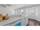Kitchen area features white cabinets and updated countertops at 6209 Lenaking Ave, Las Vegas, NV 89122