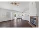 Bright living room features wood floors, vaulted ceilings, and a cozy fireplace at 6209 Lenaking Ave, Las Vegas, NV 89122