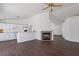 Open living room features recessed lights, wood floors, and a fireplace at 6209 Lenaking Ave, Las Vegas, NV 89122
