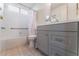 Bathroom with tiled shower and tub combo and modern vanity at 6370 Canyon Vista Ct, Las Vegas, NV 89156