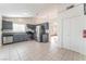 Eat-in kitchen features stainless steel appliances, gray cabinets, and tiled floors at 6370 Canyon Vista Ct, Las Vegas, NV 89156
