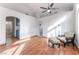 Open living room with vaulted ceilings, wood floors, and an archway at 6370 Canyon Vista Ct, Las Vegas, NV 89156