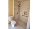 Modern walk-in shower with stylish tile and convenient grab bar at 66 Lailani St, Las Vegas, NV 89110