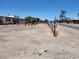 Spacious front yard with fence and home in background, plus adjacent street at 66 Lailani St, Las Vegas, NV 89110