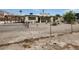 Charming front yard view of home, showing fence, landscaping and elevated deck at 66 Lailani St, Las Vegas, NV 89110