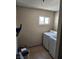 Laundry room features tile floor and a washer and dryer at 66 Lailani St, Las Vegas, NV 89110