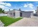 Backyard featuring a covered patio, lawn and gravel at 6741 Bonillo Dr, Las Vegas, NV 89103