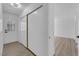 Hallway with sliding closet doors and entrance to living space at 6741 Bonillo Dr, Las Vegas, NV 89103
