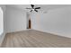 Neutral living room with wood-look flooring and natural light at 6741 Bonillo Dr, Las Vegas, NV 89103