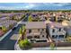 Aerial view of a multi-story home with backyard pool and spa in a neighborhood with mature trees at 7311 Spring Flower Ave, Las Vegas, NV 89117