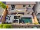 Aerial view of a backyard with a sparkling pool, spa, patio, and cozy seating, perfect for outdoor enjoyment at 7311 Spring Flower Ave, Las Vegas, NV 89117