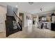 Inviting foyer with tile floors, a staircase, and views into the adjacent dining and living areas at 7311 Spring Flower Ave, Las Vegas, NV 89117