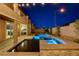 Backyard pool and spa with water feature and access from the patio, as well as kitchen access at 7311 Spring Flower Ave, Las Vegas, NV 89117