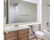 Bathroom featuring a vanity, toilet, and bathtub with tile surround at 7525 Royal Crystal St, Las Vegas, NV 89149