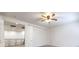A light and airy bedroom with ceiling fan with view to staircase and decorative wrought iron railing at 7525 Royal Crystal St, Las Vegas, NV 89149