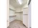 This walk-in closet features an open storage system and carpeted floors at 7525 Royal Crystal St, Las Vegas, NV 89149