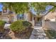 Charming single-Gathering home with manicured landscaping, paved walkway, and decorative exterior features at 7525 Royal Crystal St, Las Vegas, NV 89149