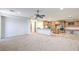 Open-concept living room and kitchen boasts modern appliances, and an island at 7525 Royal Crystal St, Las Vegas, NV 89149