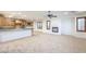 Open concept living area featuring a fireplace and a bright modern kitchen at 7525 Royal Crystal St, Las Vegas, NV 89149