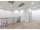 An empty loft area featuring decorative iron railing, and recessed lighting at 7525 Royal Crystal St, Las Vegas, NV 89149