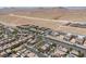 An aerial view of a neighborhood with rows of houses and green trees near mountains at 7775 Santos Bay Ct, Las Vegas, NV 89179
