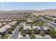 Expansive aerial view of a well-planned community with desert landscaping and mountain views at 7775 Santos Bay Ct, Las Vegas, NV 89179