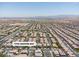Neighborhood aerial view showcases community layout, nearby streets, and surrounding landscape at 7775 Santos Bay Ct, Las Vegas, NV 89179