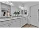 Elegant bathroom featuring double sinks, stylish fixtures, and ample counter space at 7775 Santos Bay Ct, Las Vegas, NV 89179