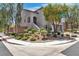 Charming two-story home with desert landscaping and a front entrance with stairs leading up to the door at 7775 Santos Bay Ct, Las Vegas, NV 89179