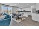 Open floor plan with an island kitchen, dining area and living room with sliding doors at 7775 Santos Bay Ct, Las Vegas, NV 89179