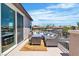 Relaxing outdoor patio featuring comfortable seating and scenic views of the neighborhood and blue sky at 7775 Santos Bay Ct, Las Vegas, NV 89179
