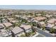 A street showcases the residential area's layout with tidy yards and landscaping, emphasizing community appeal at 7775 Santos Bay Ct, Las Vegas, NV 89179