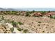 Aerial view of desert landscape with walking trails and community in the distance at 8229 Sedona Sunrise Dr, Las Vegas, NV 89128
