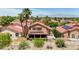 Backyard aerial view with solar panels, desert landscape, and mountain views at 8229 Sedona Sunrise Dr, Las Vegas, NV 89128
