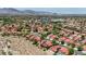 High angle view features lush community near mountains and desert at 8229 Sedona Sunrise Dr, Las Vegas, NV 89128