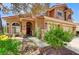 Charming home showcasing a well-maintained lawn and a welcoming entrance, with a side-entry three car garage at 8229 Sedona Sunrise Dr, Las Vegas, NV 89128