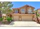 Charming two-story home featuring a well-maintained lawn and a two-car garage at 8229 Sedona Sunrise Dr, Las Vegas, NV 89128