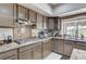 Kitchen features granite countertops, stainless steel appliances, and abundant cabinet space at 8229 Sedona Sunrise Dr, Las Vegas, NV 89128