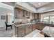 Kitchen with stainless steel appliances, granite countertops, a breakfast bar and ample cabinetry at 8229 Sedona Sunrise Dr, Las Vegas, NV 89128