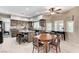 Bright kitchen and dining area featuring modern appliances, a central island, and a round table at 8229 Sedona Sunrise Dr, Las Vegas, NV 89128