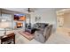 Inviting living room with fireplace, ceiling fan, and comfortable seating; perfect for relaxation and entertaining at 8229 Sedona Sunrise Dr, Las Vegas, NV 89128
