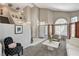 Inviting living room with large windows and a cozy seating area at 8229 Sedona Sunrise Dr, Las Vegas, NV 89128