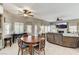 Open-concept living area featuring living room and dinning room, hardwood floors, and plenty of natural light at 8229 Sedona Sunrise Dr, Las Vegas, NV 89128